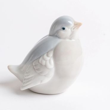 Adorable porcelain bird as a table styling accessory