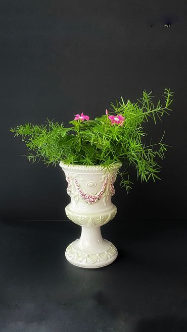 DIY floral arrangement in a porcelain footed planter