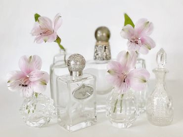 Decorative vintage bottles and bud vases for accessorizing a buffet table
