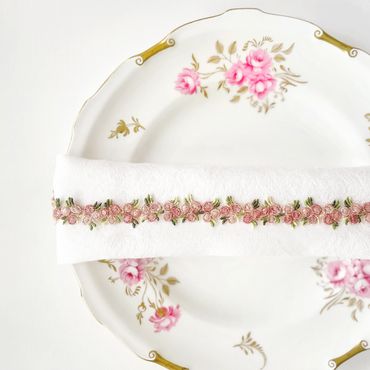 Floral patterned vintage dish with a ribbon embellished napkin