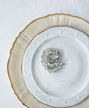 Mismatched white vintage plates for a wedding table setting