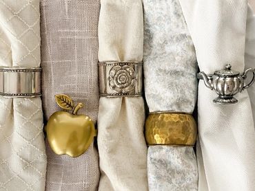 Assorted vintage napkin rings, accessorizing each guest's place setting.