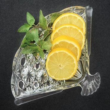 Crystal tray holding beverage garnishes