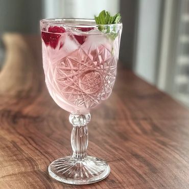 Signature beverage in a vintage goblet.
