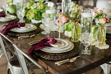 Farm-to-table themed dinner set with vintage china, glassware and silverware and accessorized with f