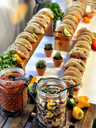 Beautiful taco station with fresh fillings and salsas, ideal for weddings and celebrations.