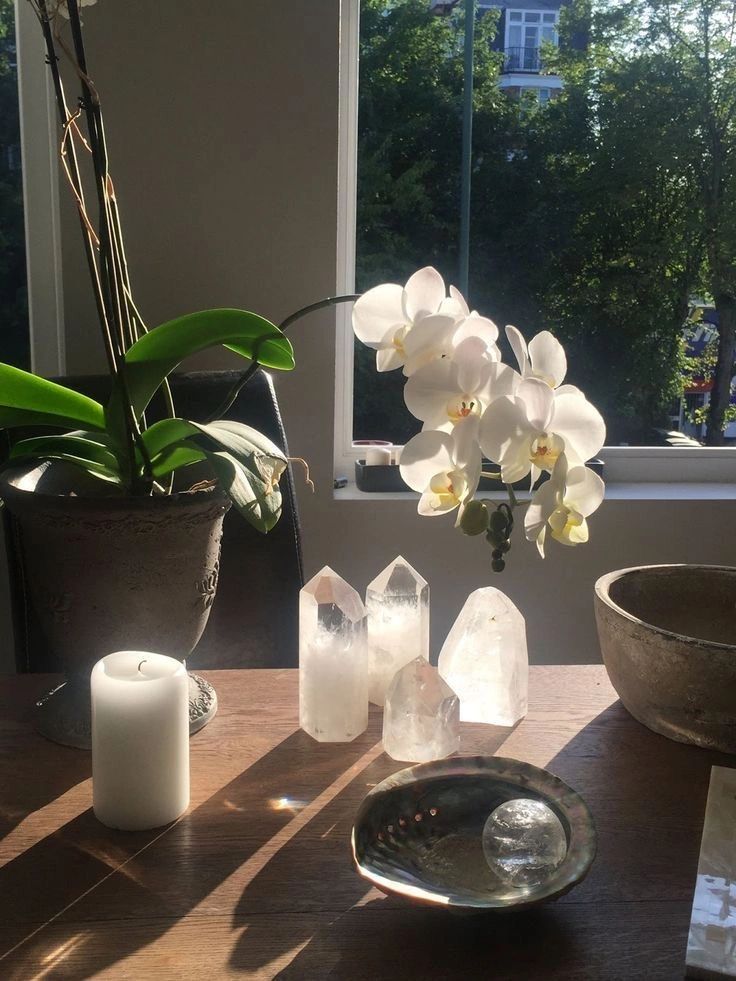 Candles, crystals, and orchids