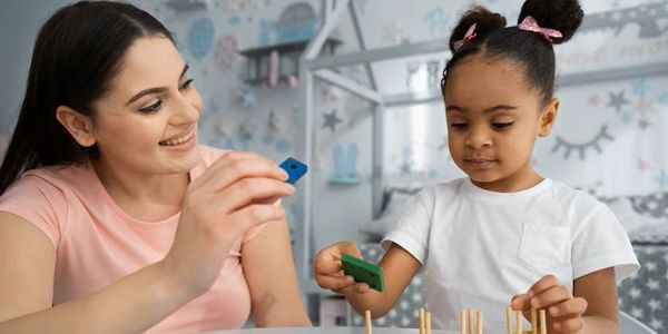 Woman and child playing an educational game together.