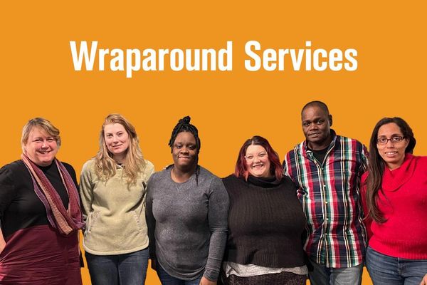 Six diverse people posing under 'Wraparound Services' text on orange background.