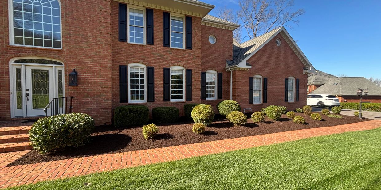 House with fresh mulch in the beds.