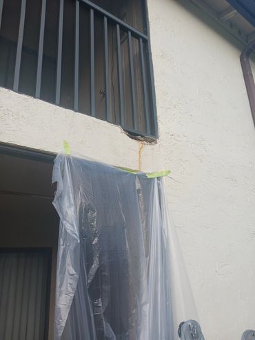 before picture of stucco repair.