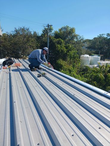 in process of replacing aluminum roof panel