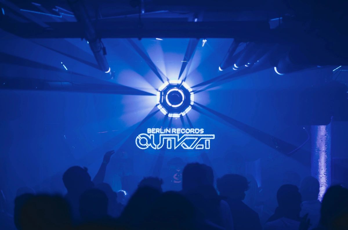 Blue-lit crowd at a Berlin Records event.