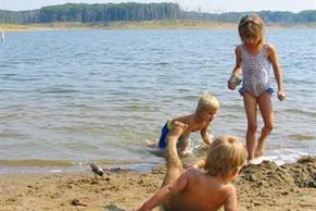 We are 6 miles from Spalding Beach where there is a bath house with showers and bathrooms. There is