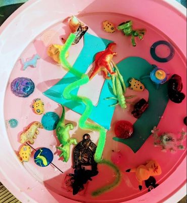 Resin with coloful toys and items in a mold