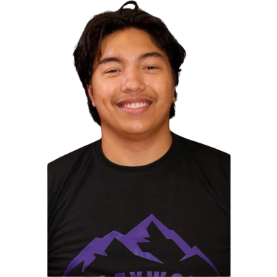 Smiling man wearing a black t-shirt with a purple mountain design.