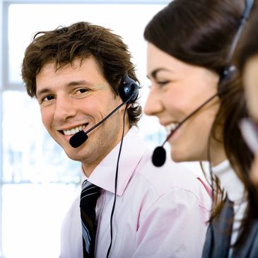 Call center agents wearing headsets.