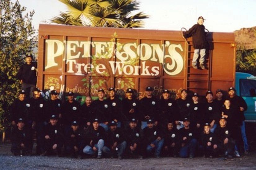 The Peterson's Tree Works crew lined up in front of the company truck in the company's early years