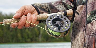 fisherman holding a fishing rod