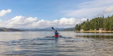 person kayaking into the distance