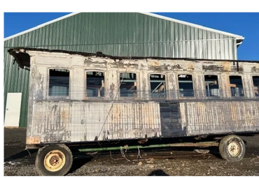D&H Canal Co. Coach 3 ready for transport to its new indoor home.