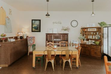 Cozy dining room with a vintage piano and rustic decor.
