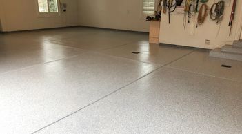 100% solids epoxy with full broadcast epoxy flake and polyaspartic top coat 