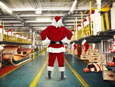 Kris Kringle warehouse with lots of toys. Santa factory.