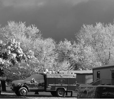 black and white picture of firetrucks 
