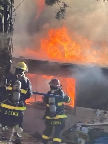 Firefighters and a burning building