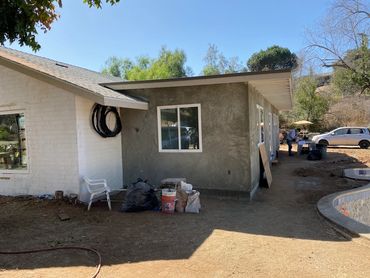 Stucco completed and roofing installed with facia primed and ready for paint in Lakeside, CA