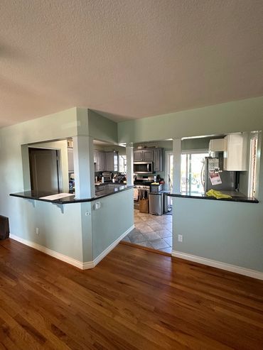 Existing kitchen area, removal of walls to create more open layout in College Area San Diego, CA