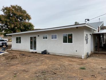Completed Lakeside, CA room addition showing stucco, windows and doors Lz Construction