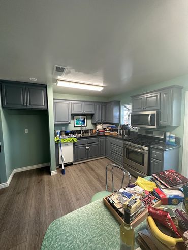 Kitchen remodeling with walls removed and refrigerator cove created