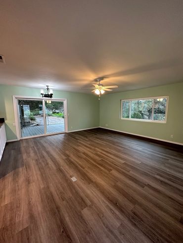 Dining area in Alpine, new floors, paint, and sliding glass door by LZ Construction
