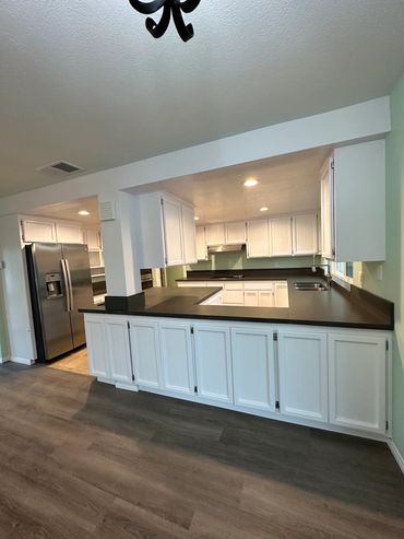 Finished kitchen with new painting, floors, and countertops in Alpine CA, by LZ Construction