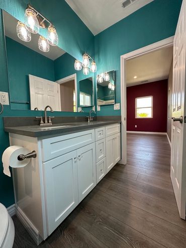 New bathroom with custom vanity, countertops College Area San Diego room addition LZ Construction