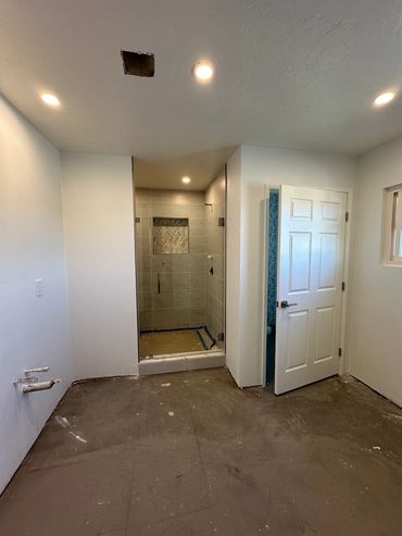 New open layout before vanity cabinets are in stalled in bathroom remodel by LZ Construction
