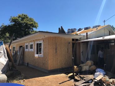 Windows and roofing being installed at Lakeside, CA room addition remodeling project
