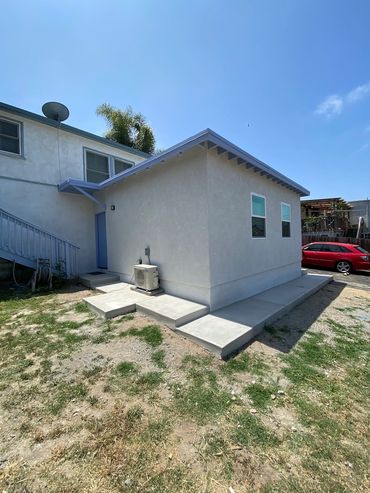 Exterior finish of Lemon Grove ADU, concrete perimeter walkways, LZ Construction Remodeling