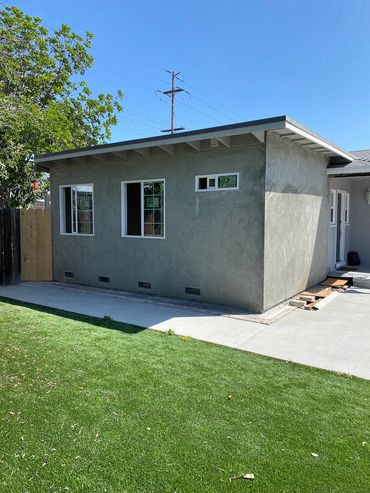 Stucco of new La Mesa addition complete with new windows and doors.