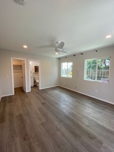 Master bedroom area of La Mesa room addition with bathroom and walk-in closet.