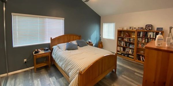 Tierrasanta bedroom remodel with new paint, flooring and drywall wrapped beam