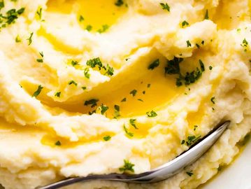 Smoke Show BBQ Creamy Garlic Mash Mashed Potatoes with Rosemary and Thyme.