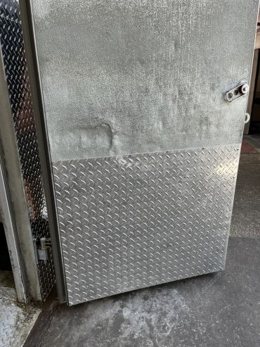 3003-H22 inside kickplate on this Walk In Cooler Door. Custom cut installed with 410 hex heads 1/4"