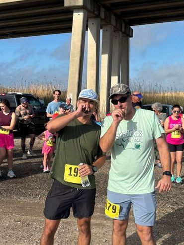 Gibbstown Bridge Run 5K with award winners blowing a duck call