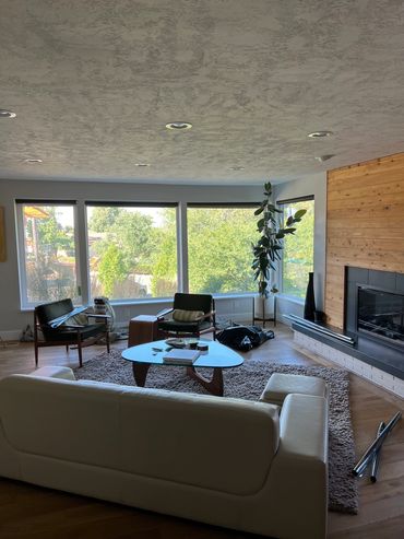 Interior view looking out of south facing front room windows after film installation of a residence