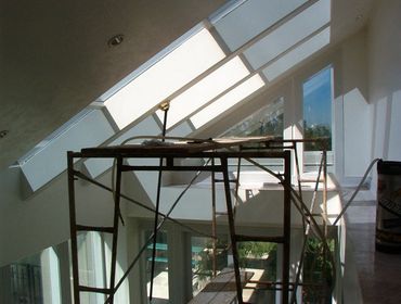 Huge home in Ogden Utah with Suntek SDS 20% being installed on sloped units in kitchen area