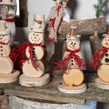 Group of handcrafted wooden snowmen