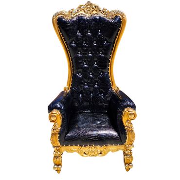 Tall black throne chair with gold frame and crystal-pinned gator-textured upholstery used for weddings, showers, and birthday photo setups.